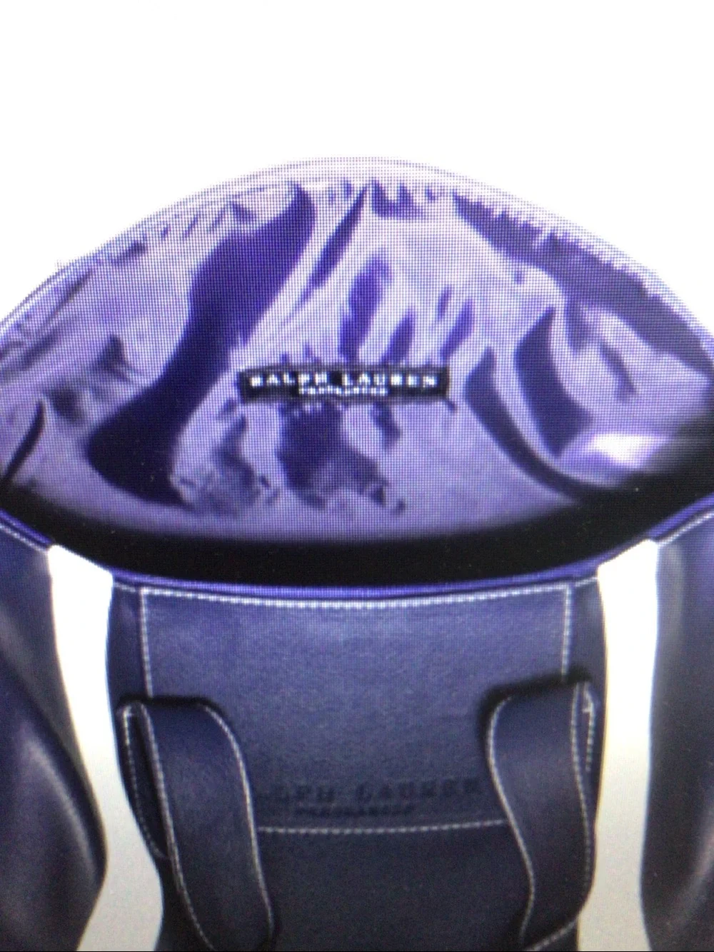 Dark blue PU leather handbag for short trips.